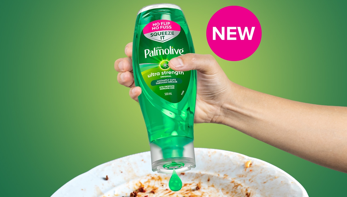 Hand holding an upside-down bottle of Palmolive Ultra Strength dishwashing liquid, squeezing out a green drop over a dirty plate on a green gradient background and a pink circle stating ‘NEW’.