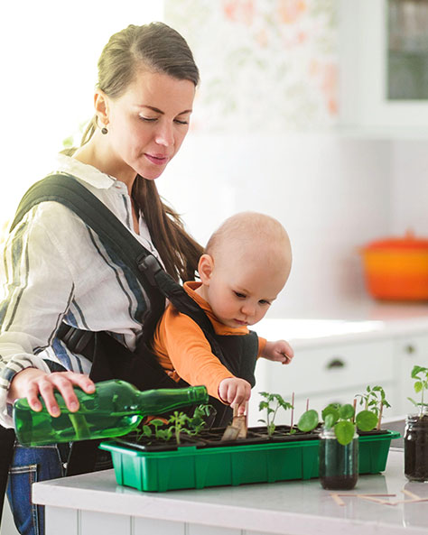 a woman and a baby in the kitchen