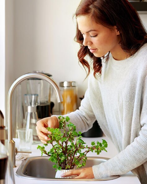 a woman and a baby in the kitchen